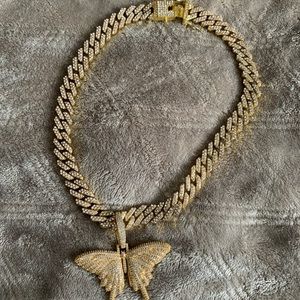 Gold tone butterfly pendant with Cuban chain